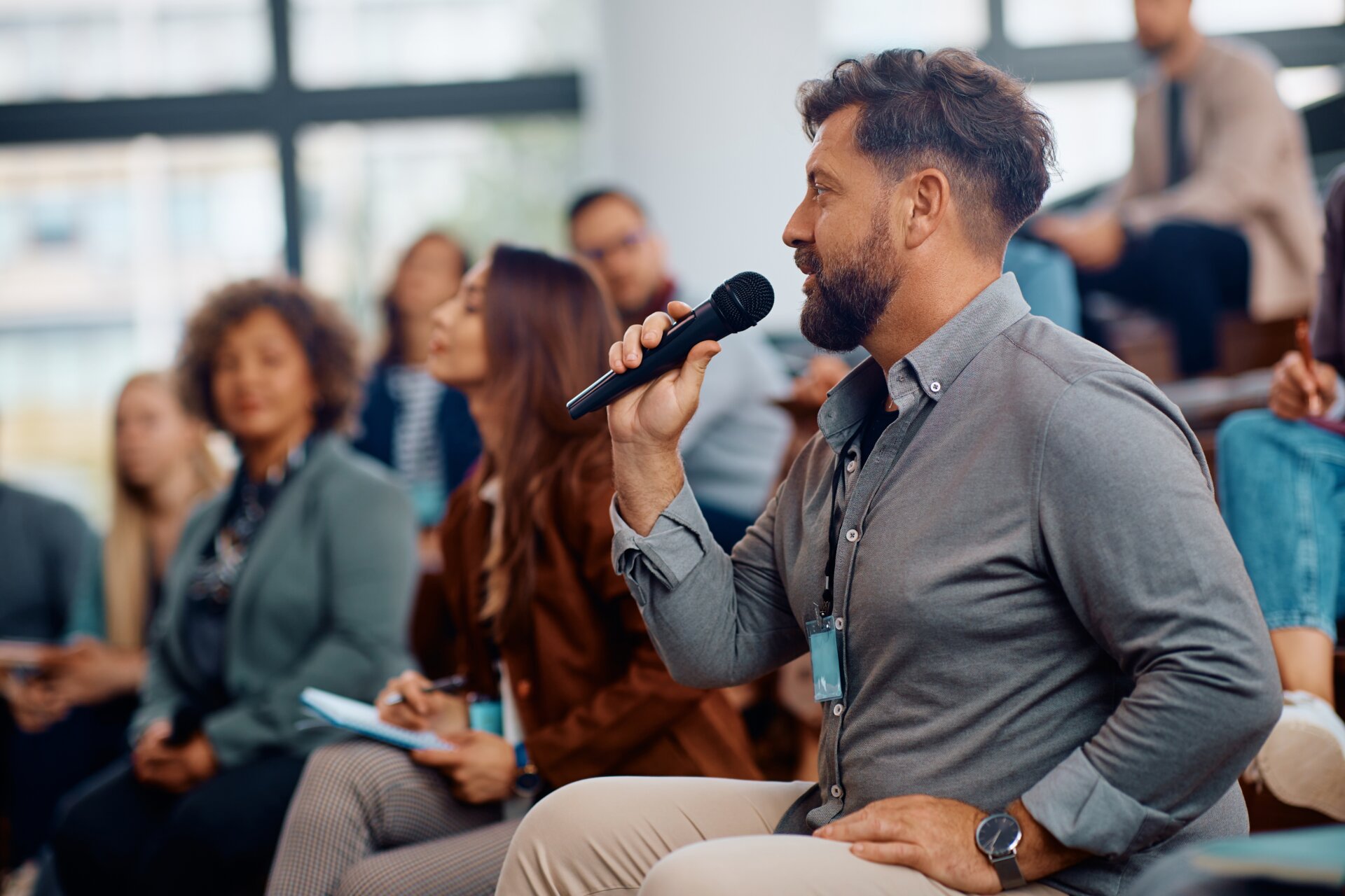 Male,Entrepreneur,Asking,A,Question,While,Attending,Business,Seminar,In